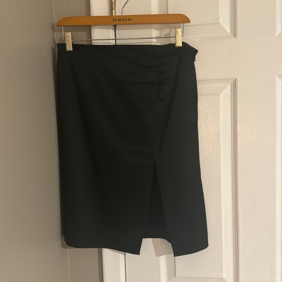 Pre-loved sexy Bebe skirt (satin feel) see pic of tag with actual material. - Picture 3 of 9